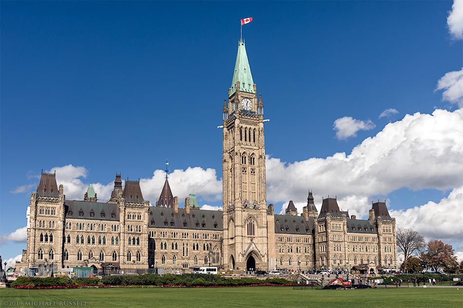 The Parliament Buildings (Centre Block) in Ottawa, Ontario, Canada. Centre Block contains the House of Commons, the Senate chambers, offices of some MP's (Members of Parliament), and administration offices.  Centre Block was completed in 1927 (construction began in 1917 after the original building burned down).  Photographed in October 2018, just before Centre Block was closed for renovations that may last 10 years.